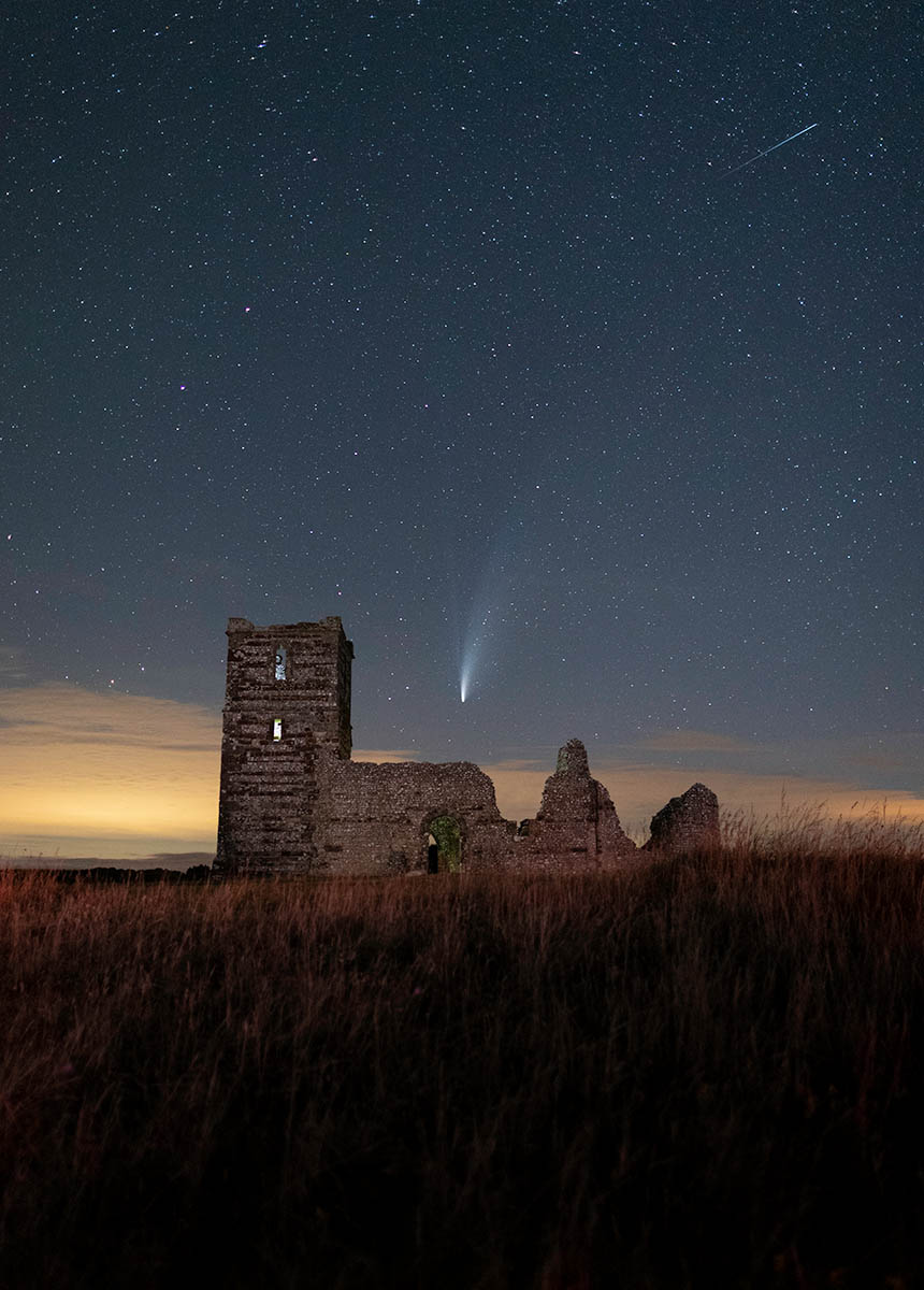 Neowise comet over Knowlton Church in Dorset, England. Buy a fine art print.