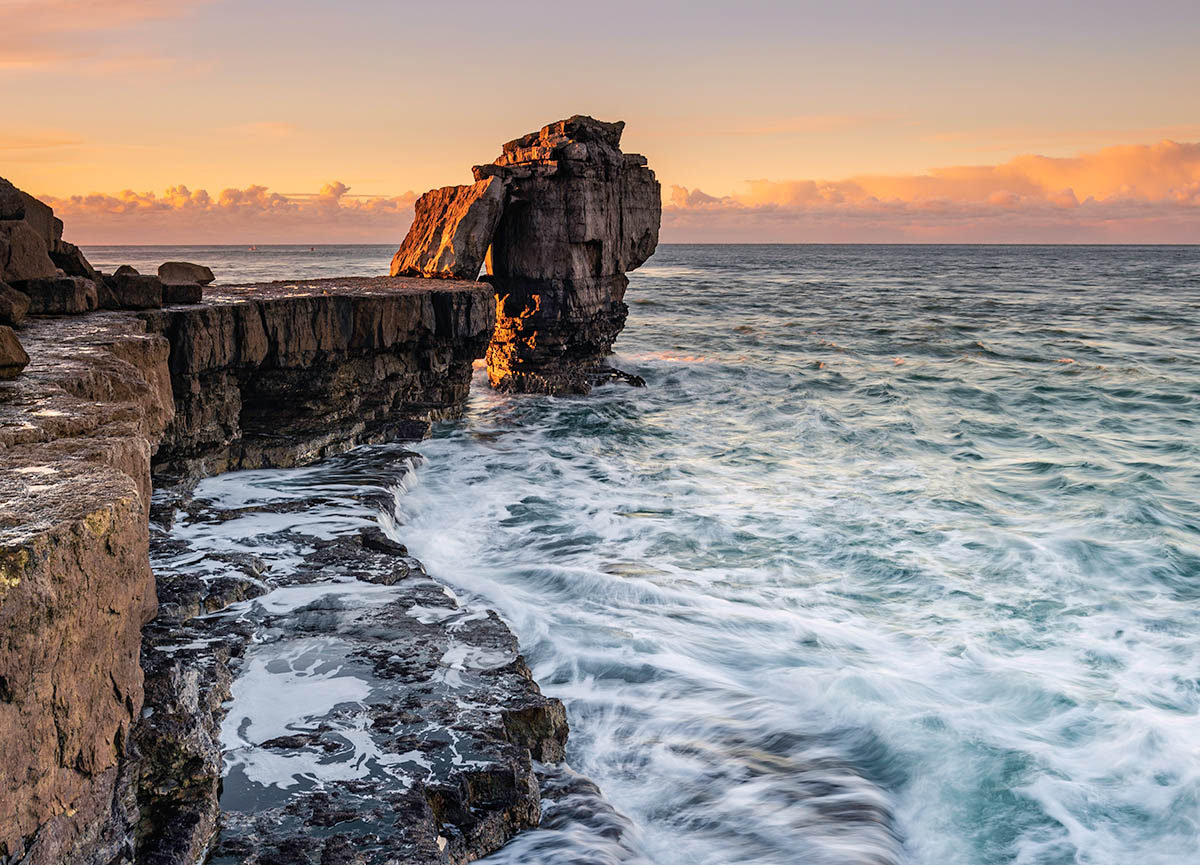 Pulpit Rock at Portland Bill at sunrise, Dorset, Jurassic Coast, England. Buy a fine art print.